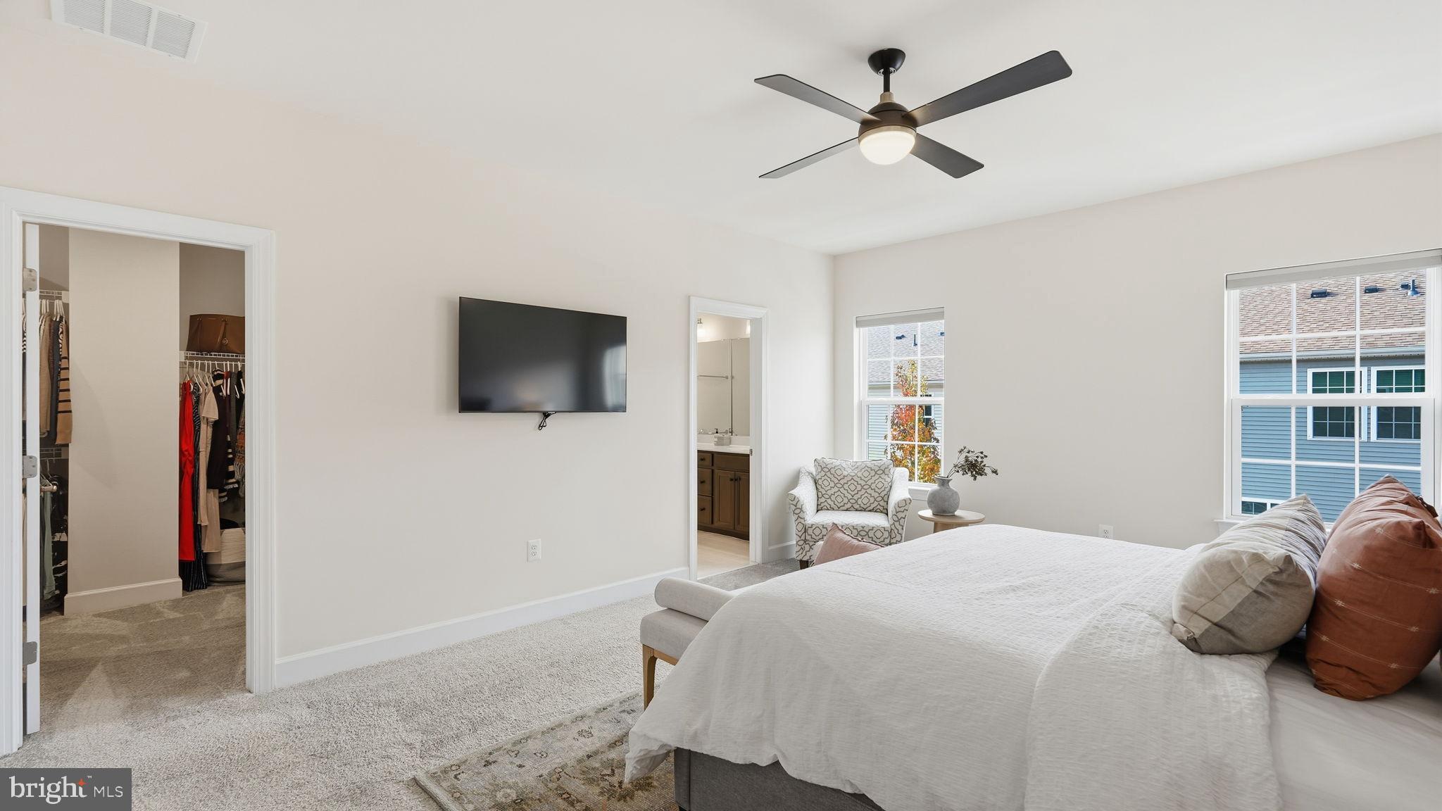 10644 Hinton Way Manassas, VA 20112 - Photo 20 of 44 a bedroom with a bed and a flat screen tv