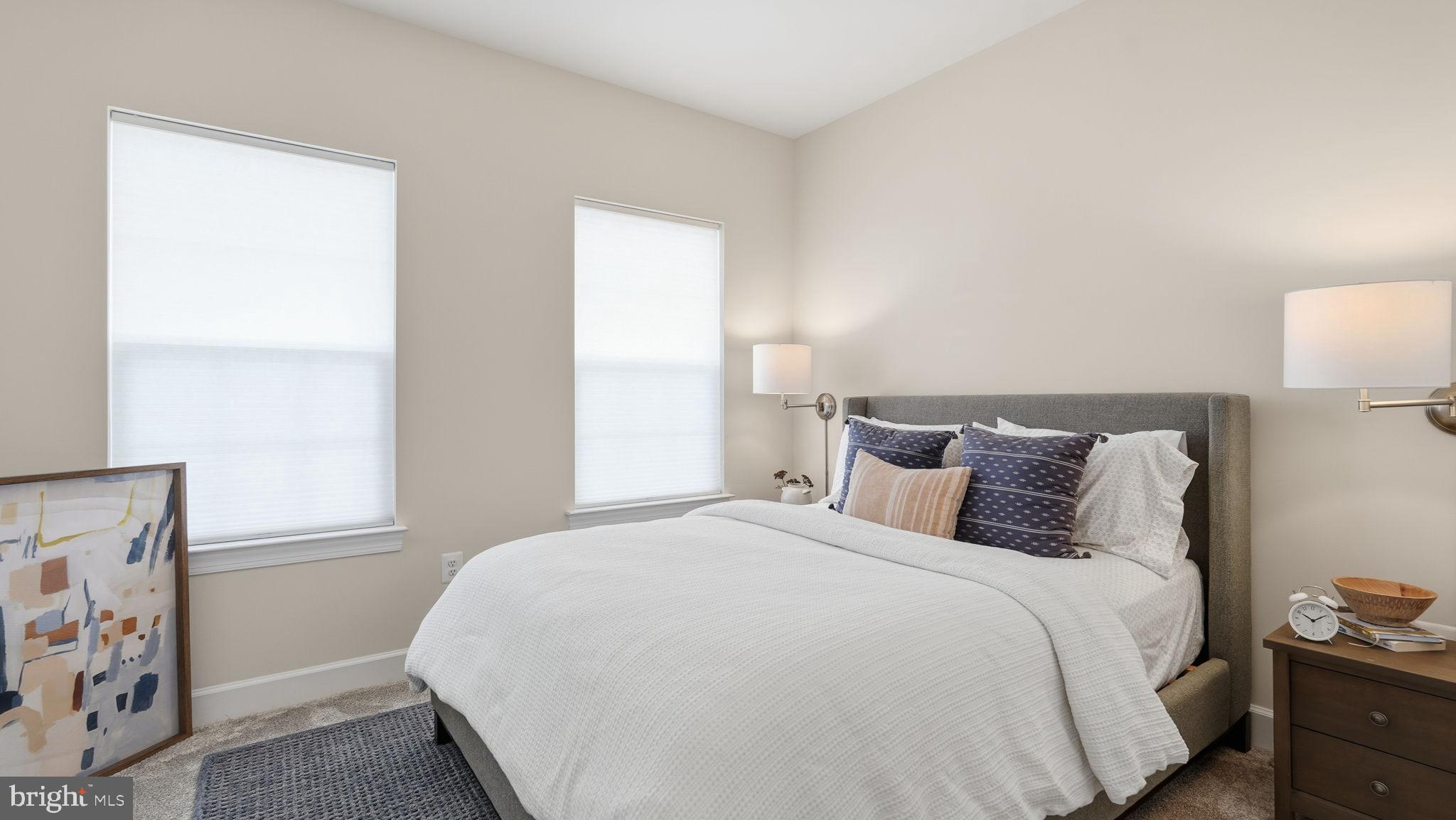 10644 Hinton Way Manassas, VA 20112 - Photo 27 of 44 a large bed sitting in a bedroom next to a window