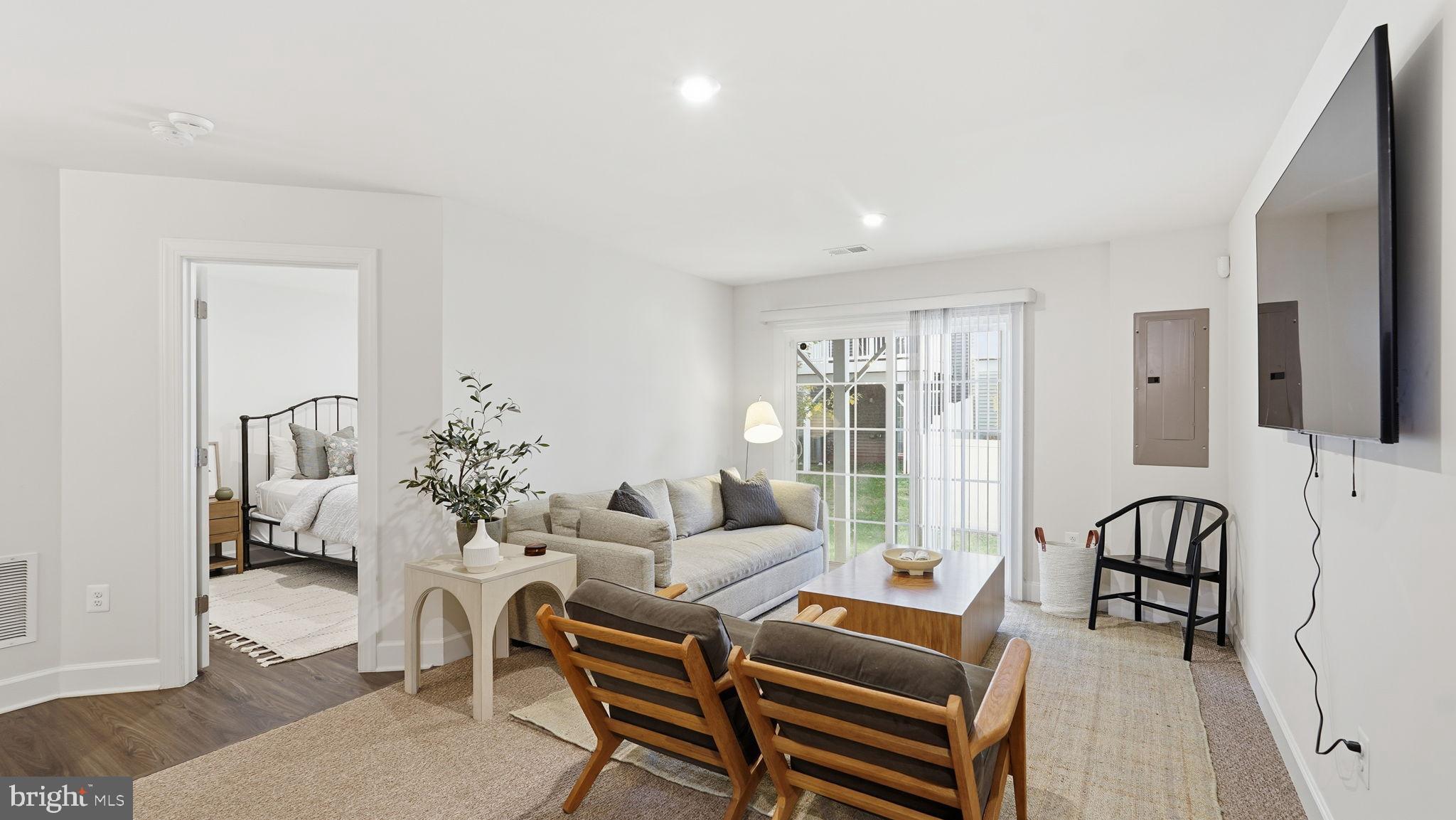 10644 Hinton Way Manassas, VA 20112 - Photo 35 of 44 a living room with furniture and a flat screen tv