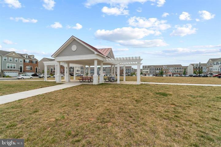 10644 Hinton Way Manassas, VA 20112 - Photo 42 of 44 a front view of a house with a yard