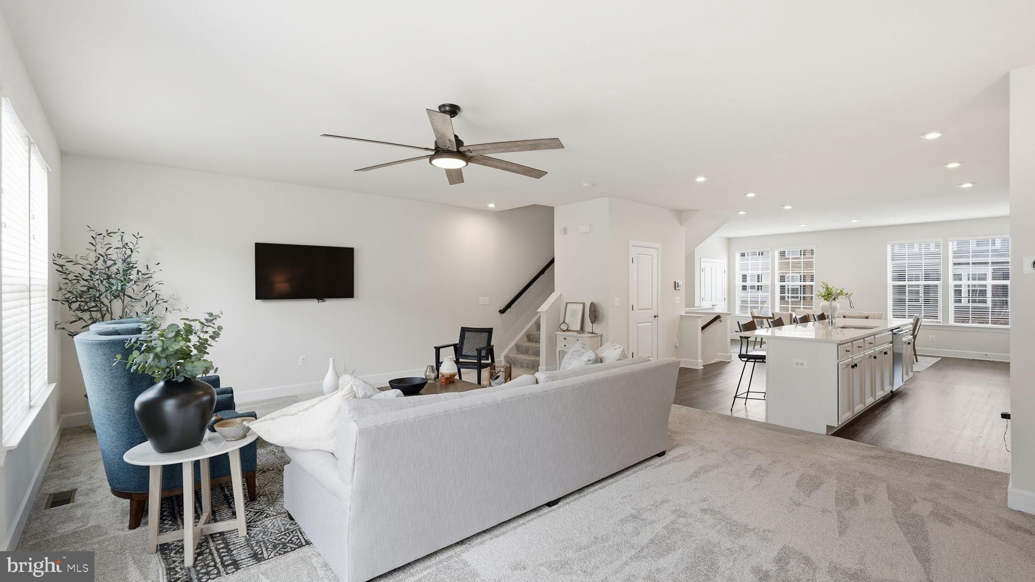 10644 Hinton Way Manassas, VA 20112 - Photo 8 of 44 a living room with furniture and a flat screen tv