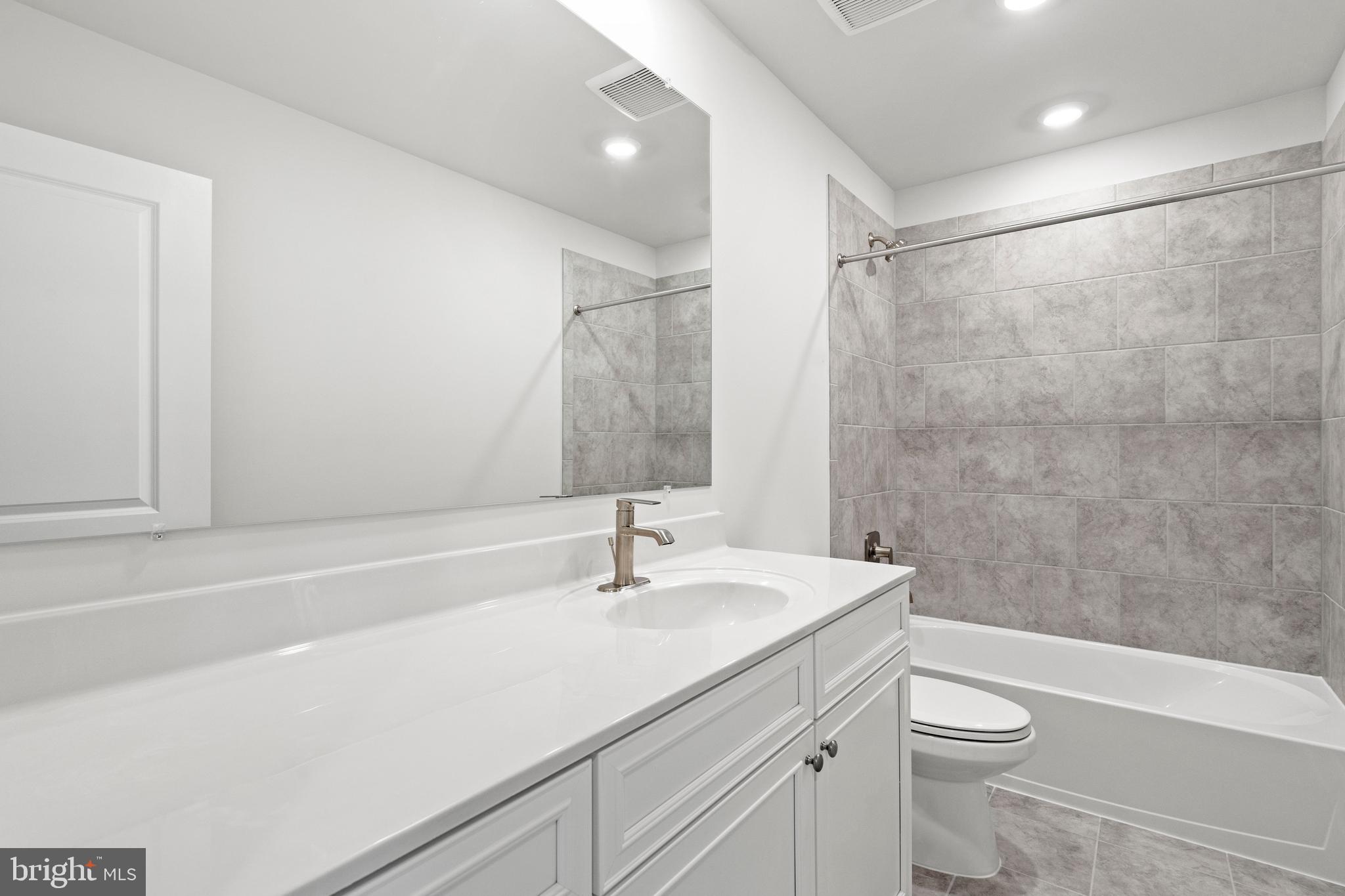 1723 Water Xing Road Pikesville, MD 21208 - Photo 25 of 32 a bathroom with a sink a toilet and shower