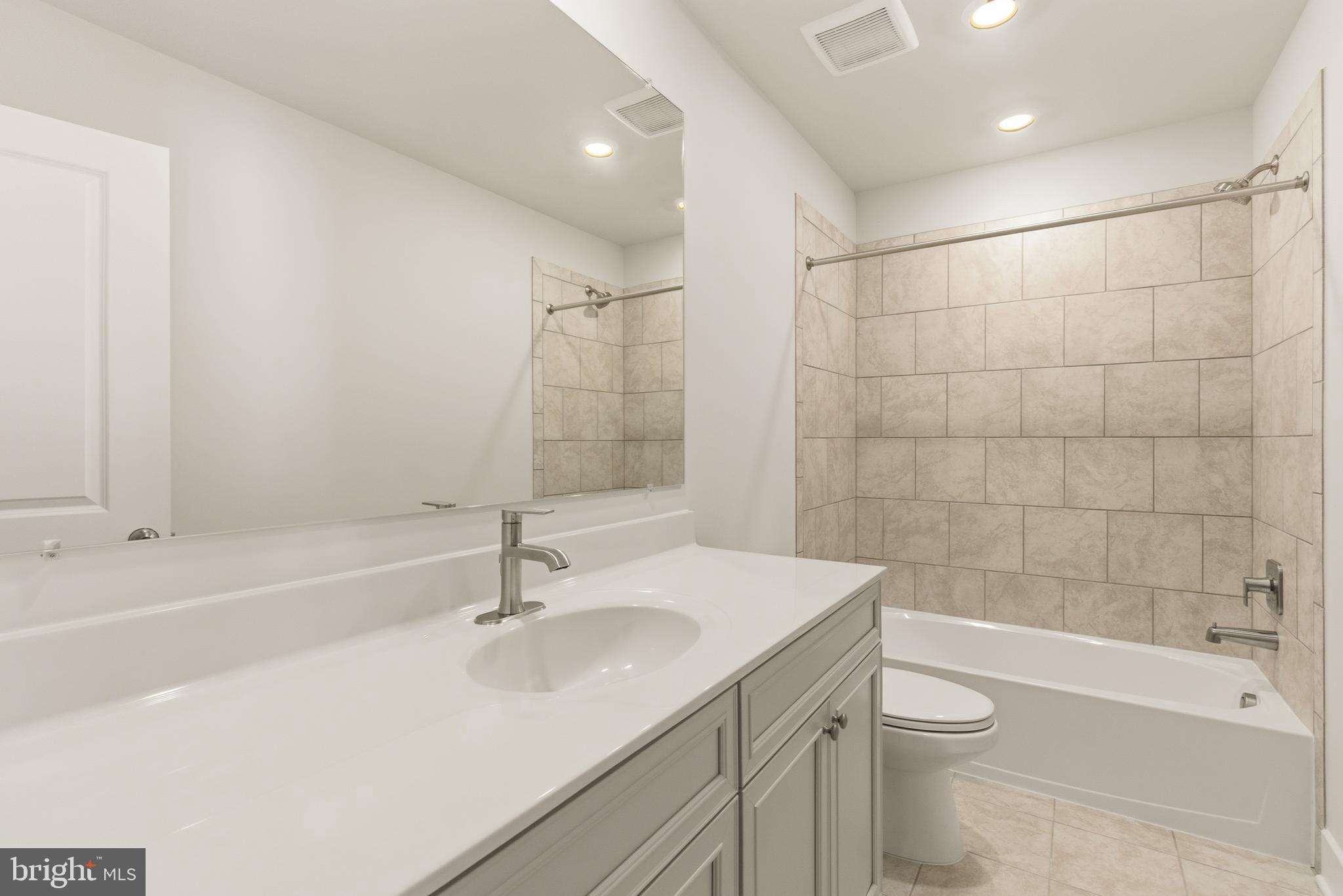 1723 Water Xing Road Pikesville, MD 21208 - Photo 27 of 37 a bathroom with a sink a toilet and shower