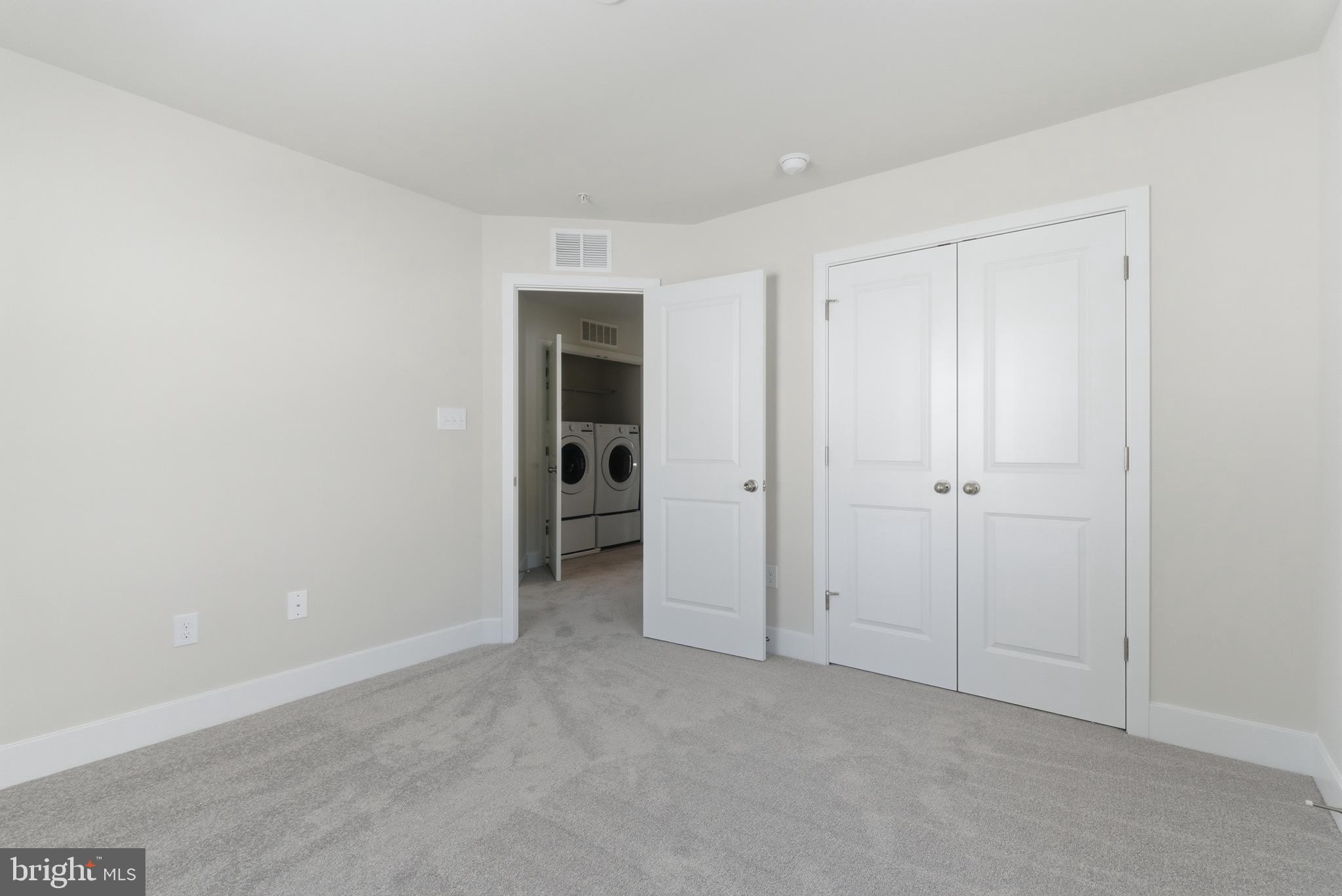 1723 Water Xing Road Pikesville, MD 21208 - Photo 29 of 37 a view of an empty room and closet area