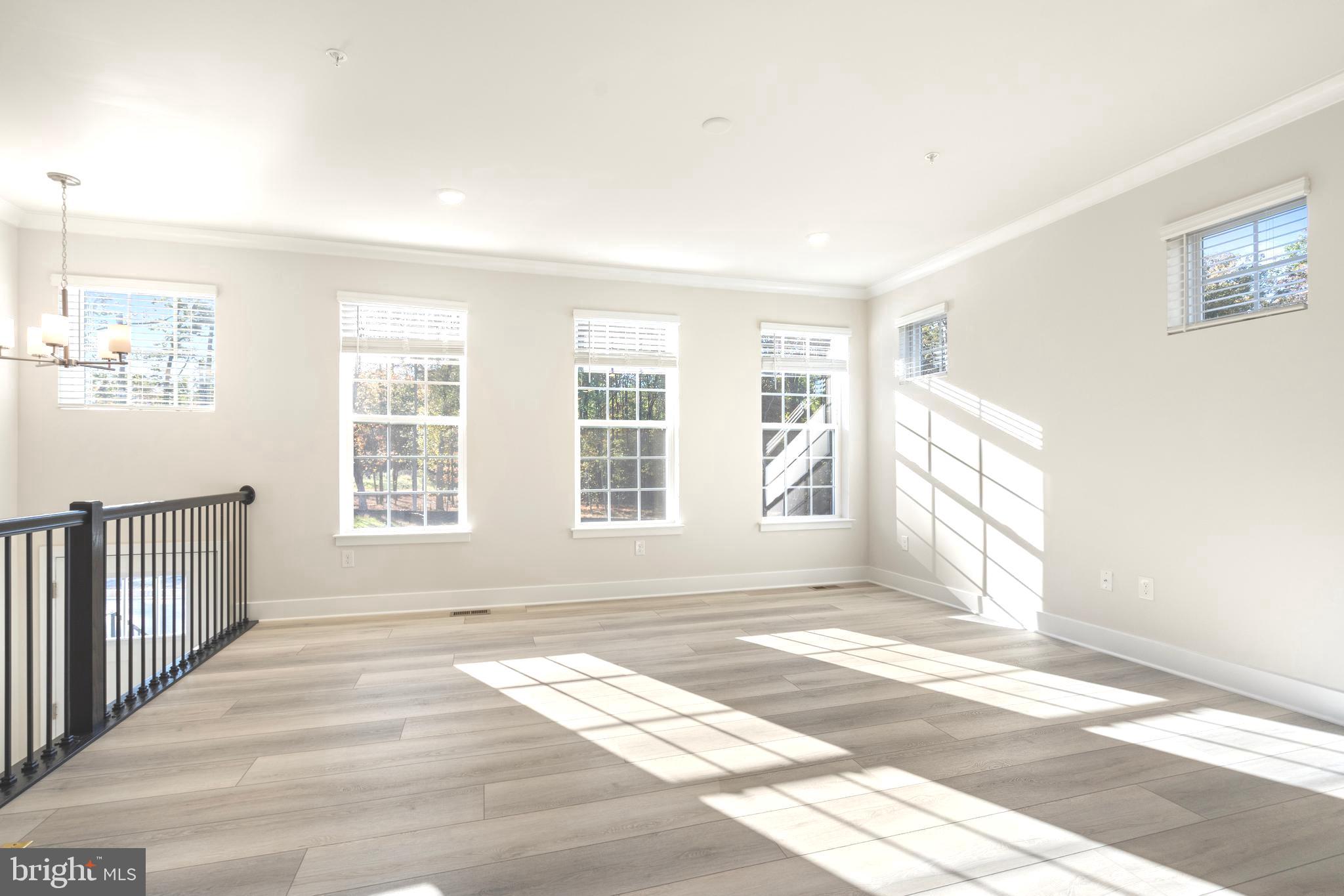 1723 Water Xing Road Pikesville, MD 21208 - Photo 3 of 32 a view of an empty room with a window