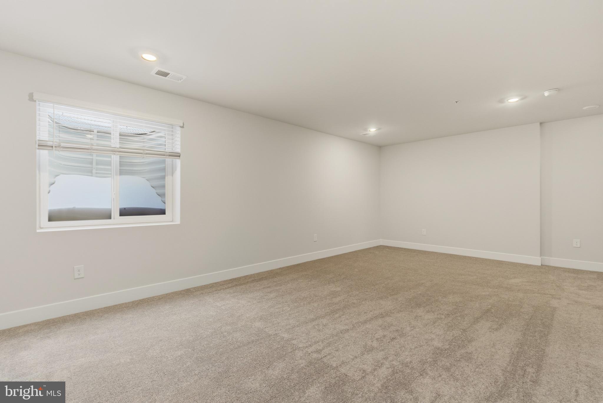 1723 Water Xing Road Pikesville, MD 21208 - Photo 31 of 37 an empty room with a window