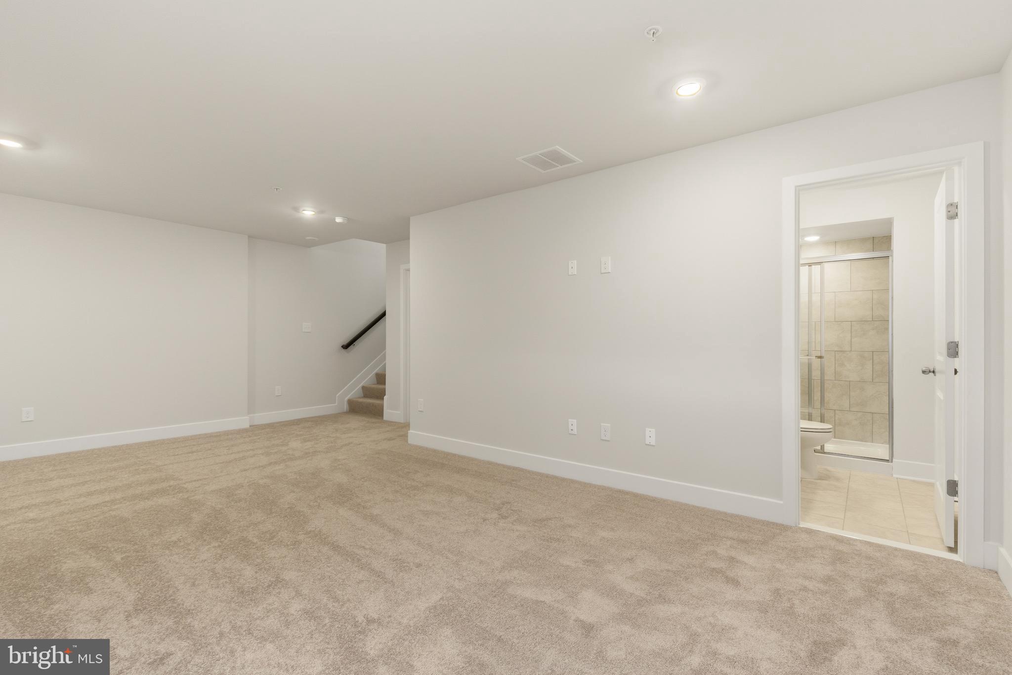 1723 Water Xing Road Pikesville, MD 21208 - Photo 32 of 37 an empty room with an entrance to other room