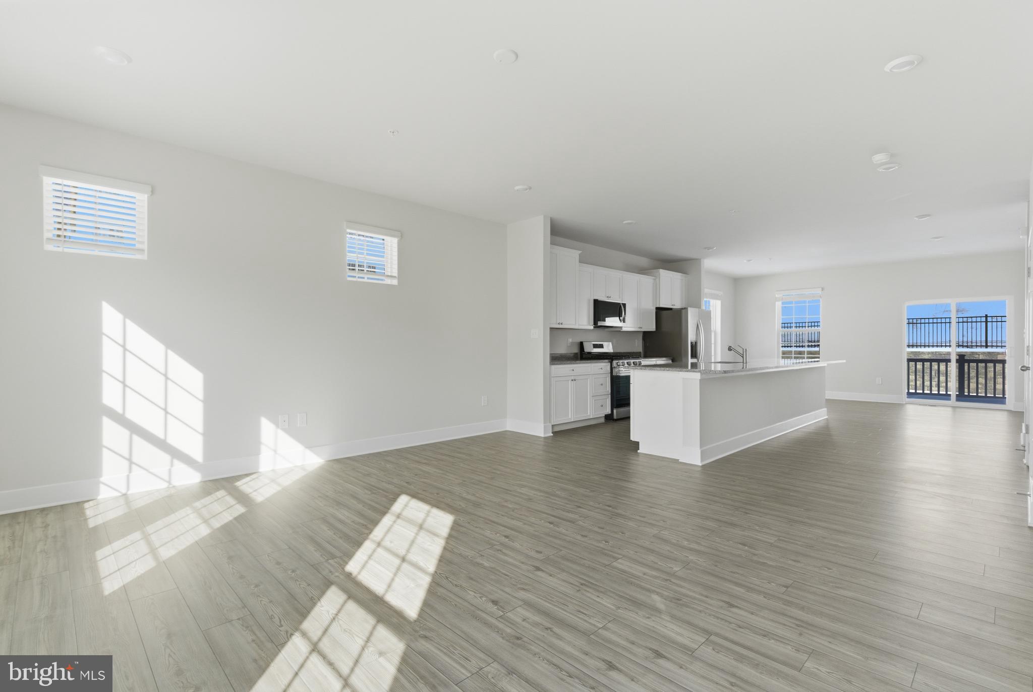 1723 Water Xing Road Pikesville, MD 21208 - Photo 5 of 37 a view of kitchen with wooden floor and electronic appliances