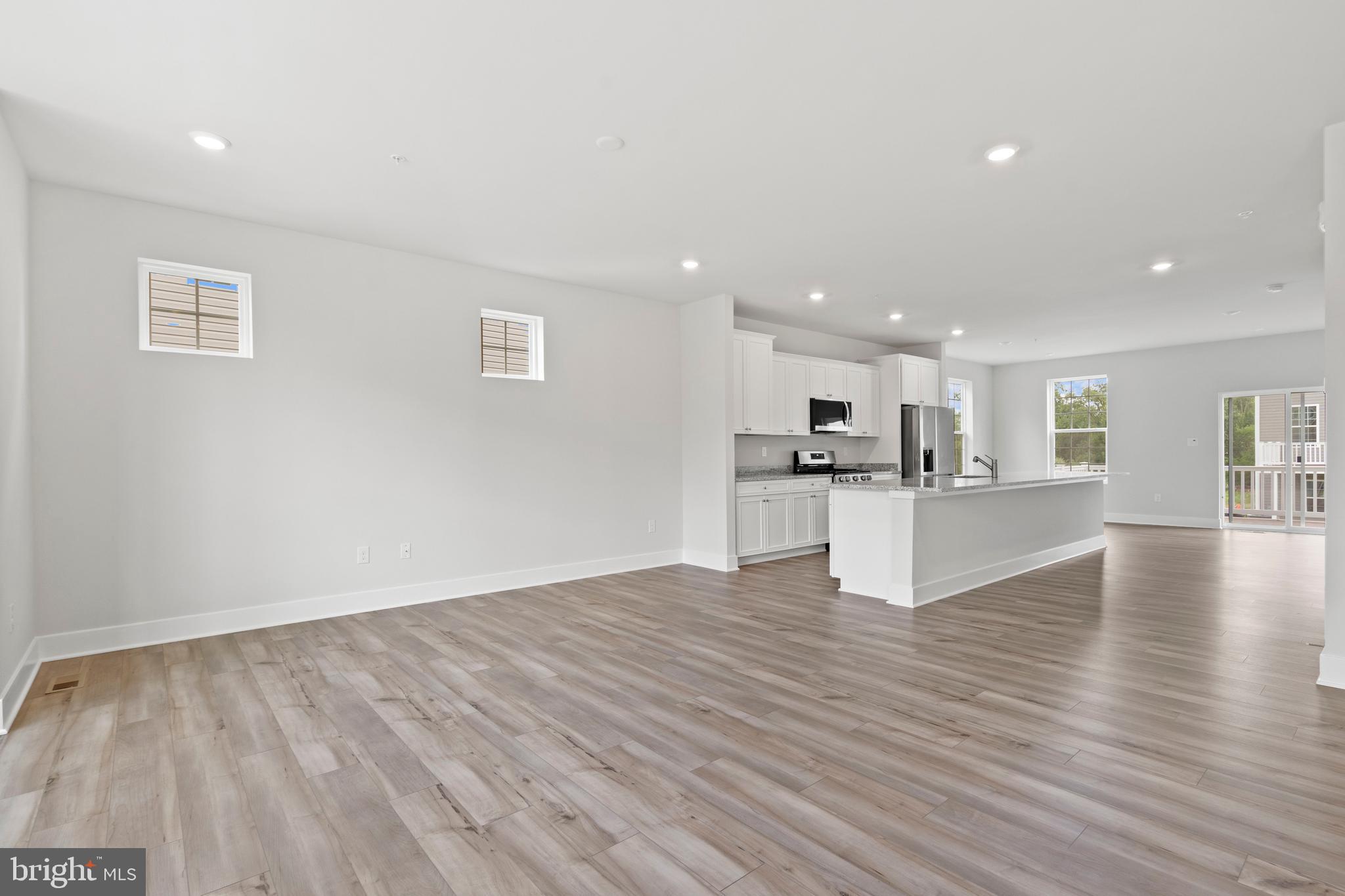 1723 Water Xing Road Pikesville, MD 21208 - Photo 5 of 32 a view of kitchen with wooden floor and kitchen