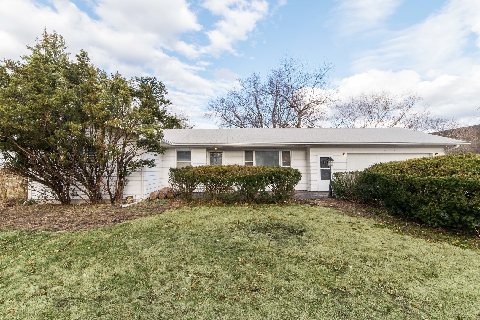 930 Normal Road DeKalb, IL 60115 - Photo 2 of 35 a view of a house with a yard and potted plants