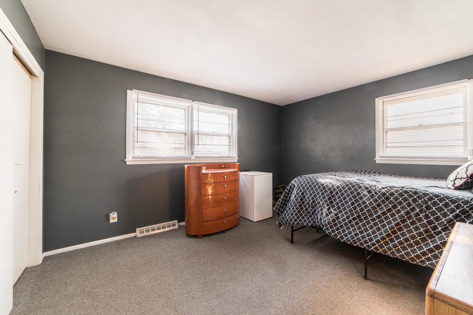 930 Normal Road DeKalb, IL 60115 - Photo 20 of 35 a room with a window and a dresser