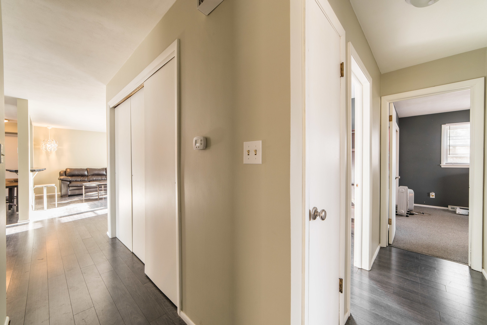 930 Normal Road DeKalb, IL 60115 - Photo 23 of 35 a view of a hallway with wooden floor windows and a kitchen