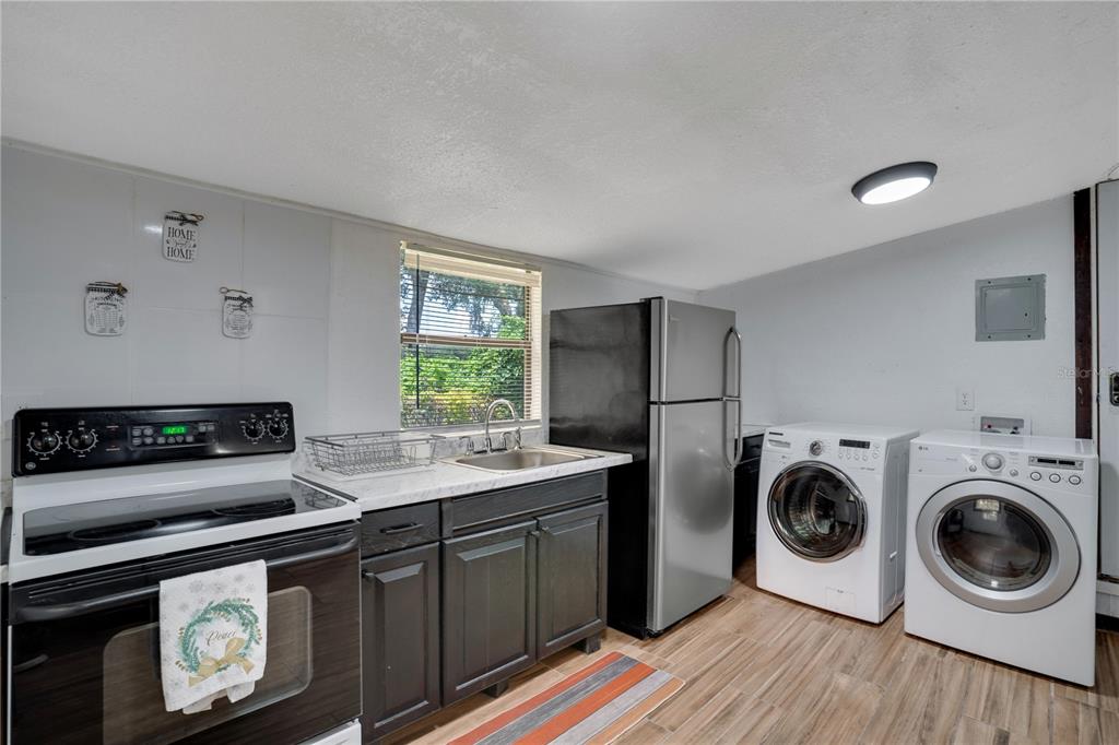 7905 Pierce Harwell Road Plant City, FL 33565 - Photo 14 of 68 a kitchen with a stove and a refrigerator