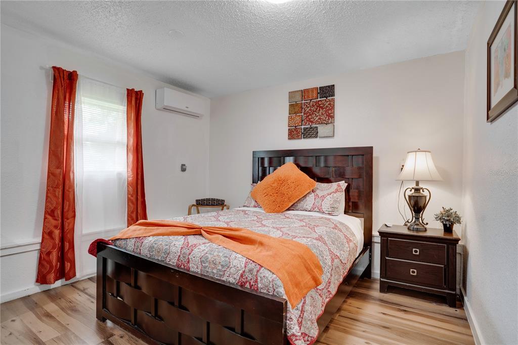 7905 Pierce Harwell Road Plant City, FL 33565 - Photo 16 of 68 a bedroom with a bed and a dresser