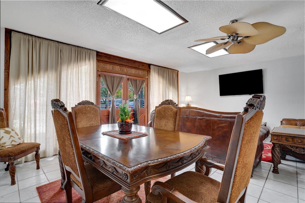 7905 Pierce Harwell Road Plant City, FL 33565 - Photo 18 of 68 a view of a dining room with furniture and a window