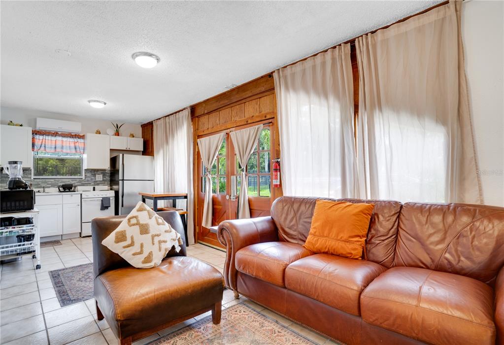 7905 Pierce Harwell Road Plant City, FL 33565 - Photo 21 of 68 a living room with furniture and a large window