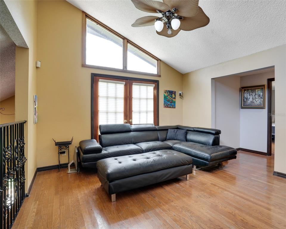 7905 Pierce Harwell Road Plant City, FL 33565 - Photo 35 of 68 a living room with furniture and a large window