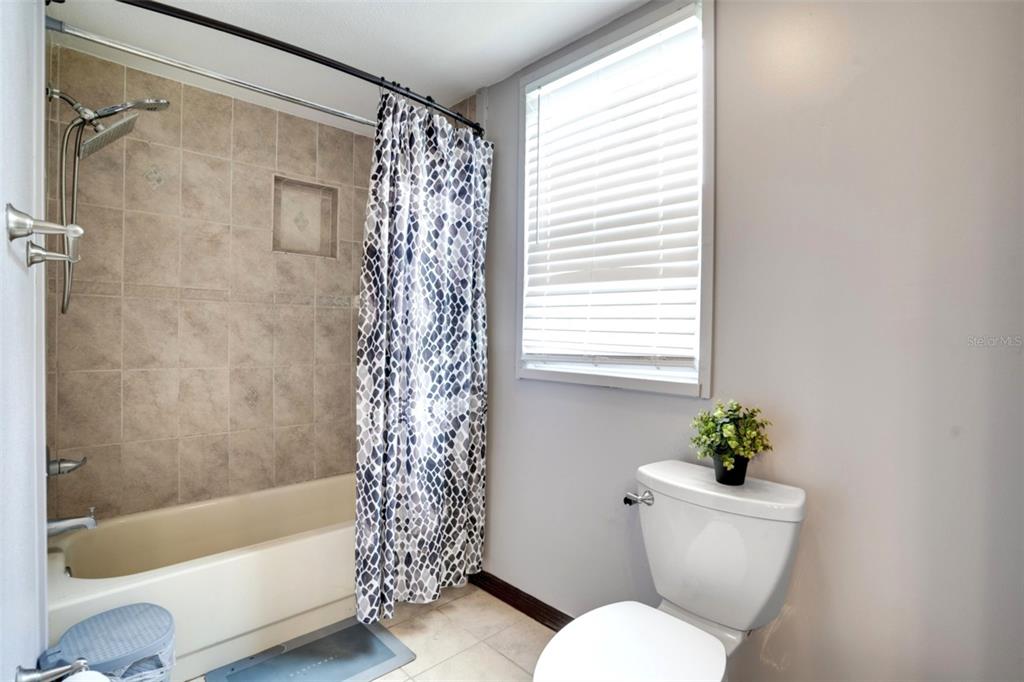 7905 Pierce Harwell Road Plant City, FL 33565 - Photo 37 of 68 a bathroom with a sink toilet and shower