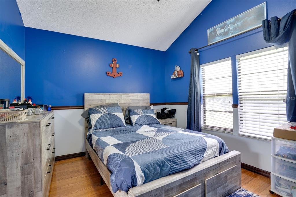 7905 Pierce Harwell Road Plant City, FL 33565 - Photo 38 of 68 a bedroom with bed and window