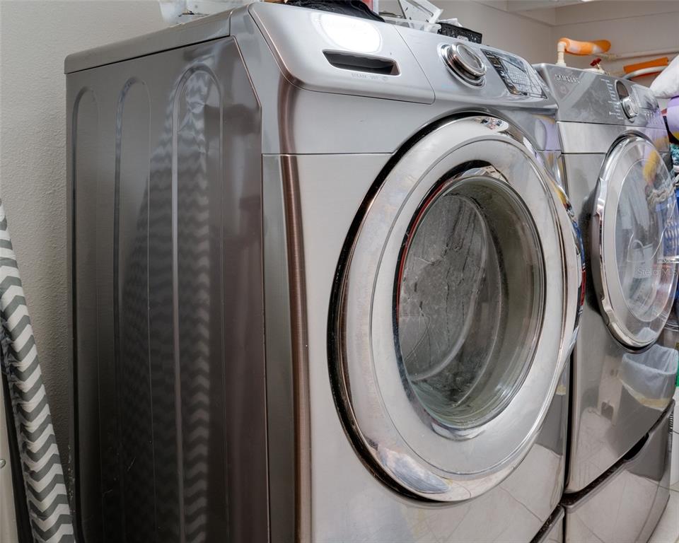7905 Pierce Harwell Road Plant City, FL 33565 - Photo 40 of 68 a close view of a utility room with dryer and washer