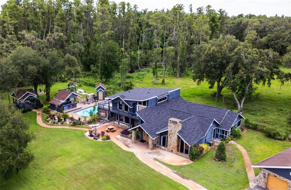 7905 Pierce Harwell Road Plant City, FL 33565 - Photo 47 of 68 an aerial view of a house with garden space and street view