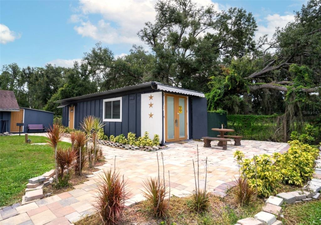 7905 Pierce Harwell Road Plant City, FL 33565 - Photo 48 of 68 a view of a house with backyard and sitting area