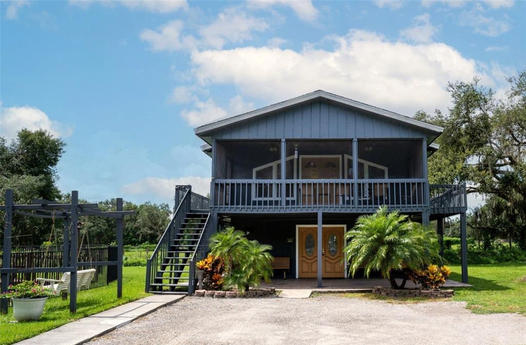 7905 Pierce Harwell Road Plant City, FL 33565 - Photo 53 of 68 a front view of a house with plants