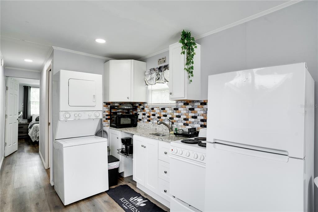7905 Pierce Harwell Road Plant City, FL 33565 - Photo 10 of 68 a white refrigerator freezer sitting inside of a kitchen