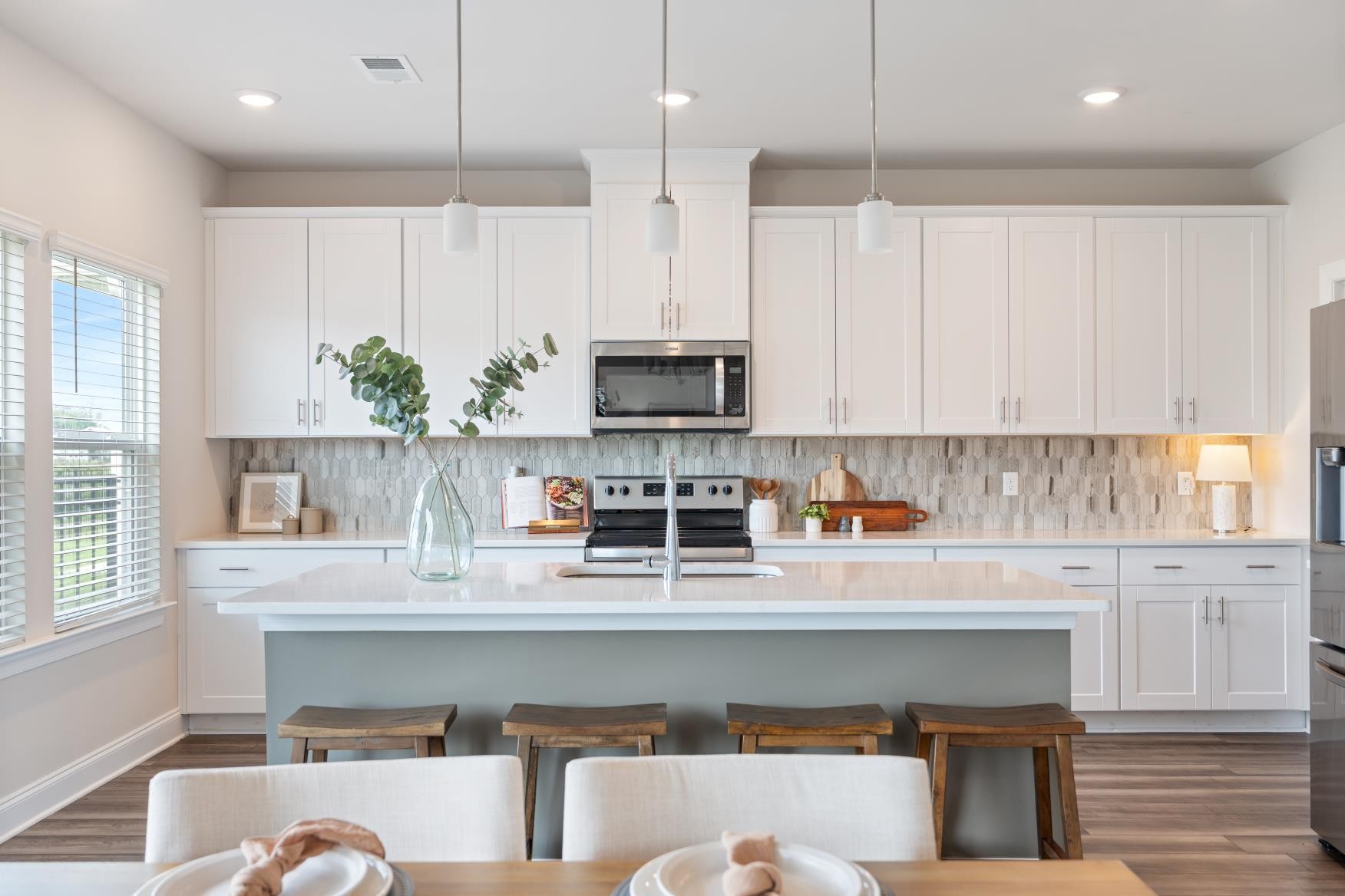 3706 Mathewson Way Murfreesboro, TN 37128 - Photo 12 of 59 a kitchen with stainless steel appliances granite countertop a stove a sink and a microwave