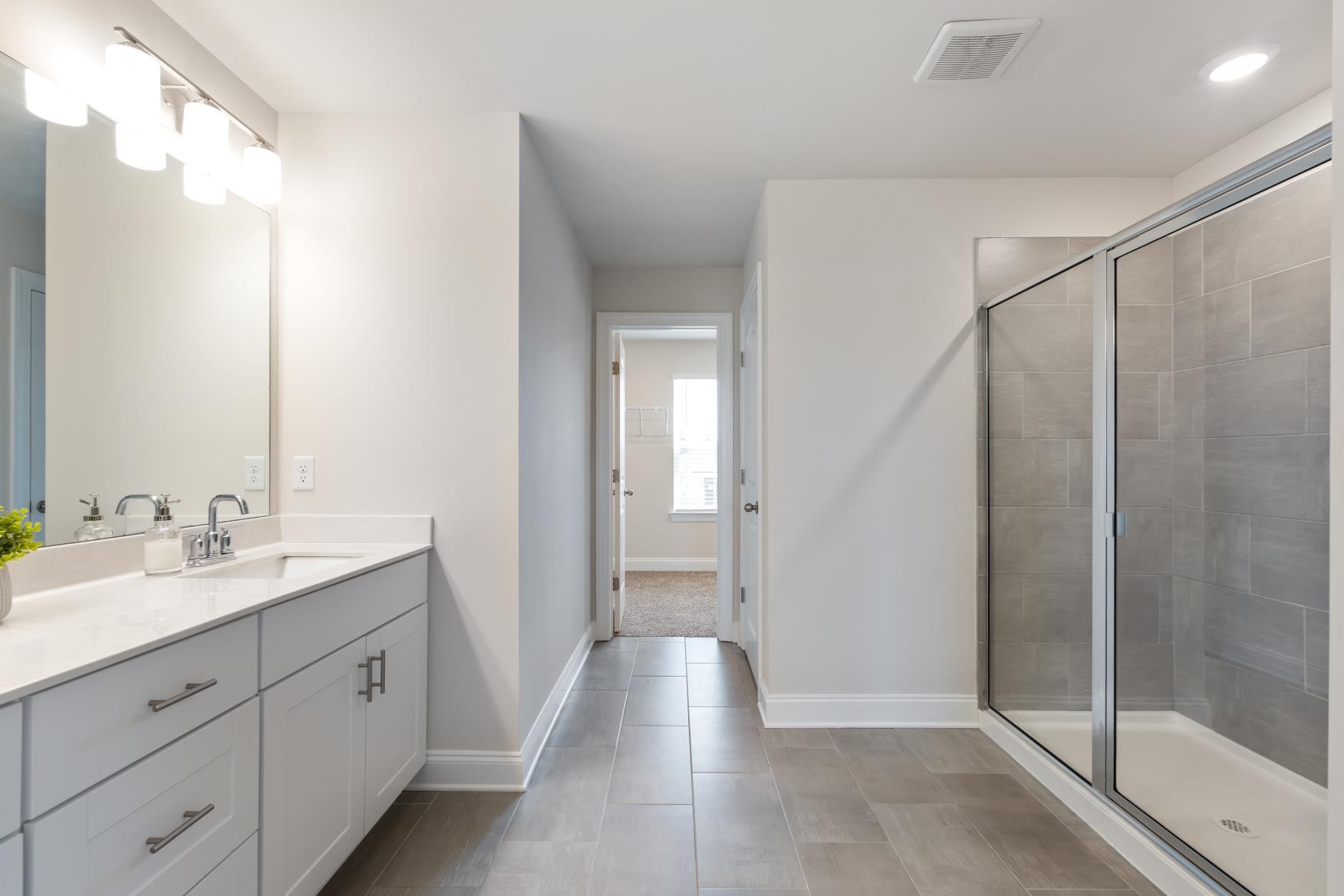 3706 Mathewson Way Murfreesboro, TN 37128 - Photo 36 of 59 a bathroom with a double vanity sink and mirror