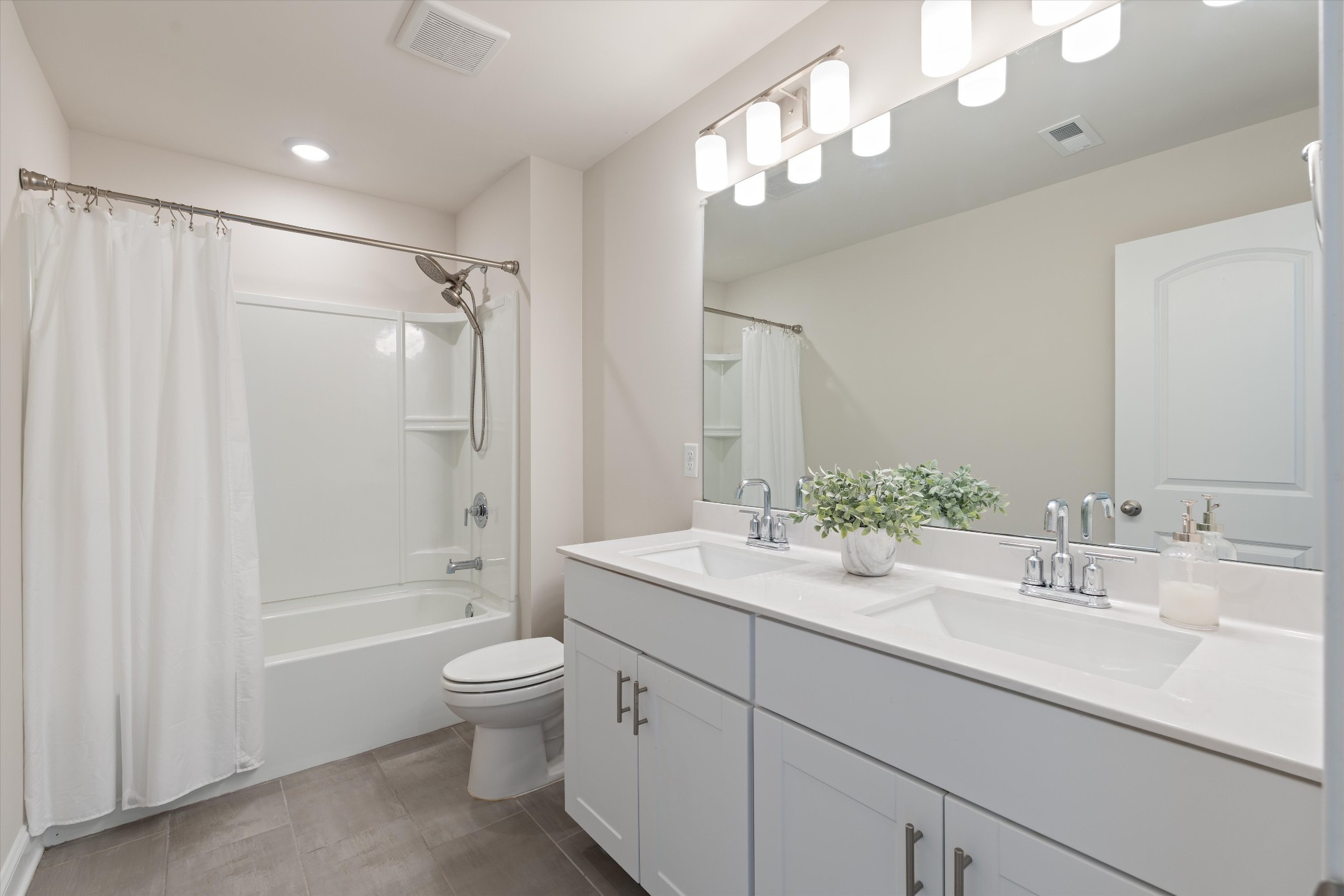 3706 Mathewson Way Murfreesboro, TN 37128 - Photo 46 of 59 a spacious bathroom with a double vanity sink toilet mirror and shower