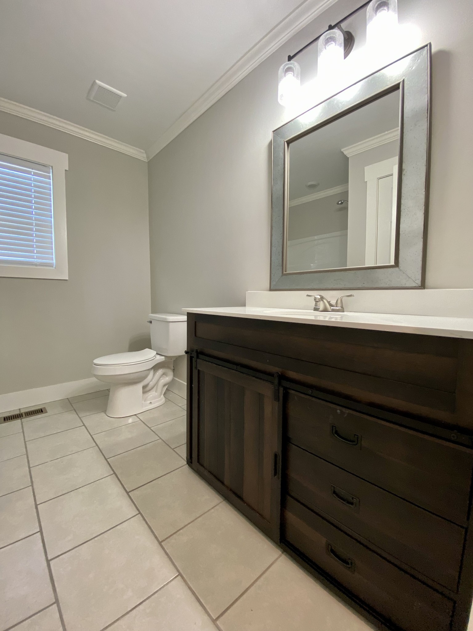90 Allred Road Decherd, TN 37324 - Photo 11 of 22 a bathroom with a sink a toilet and mirror