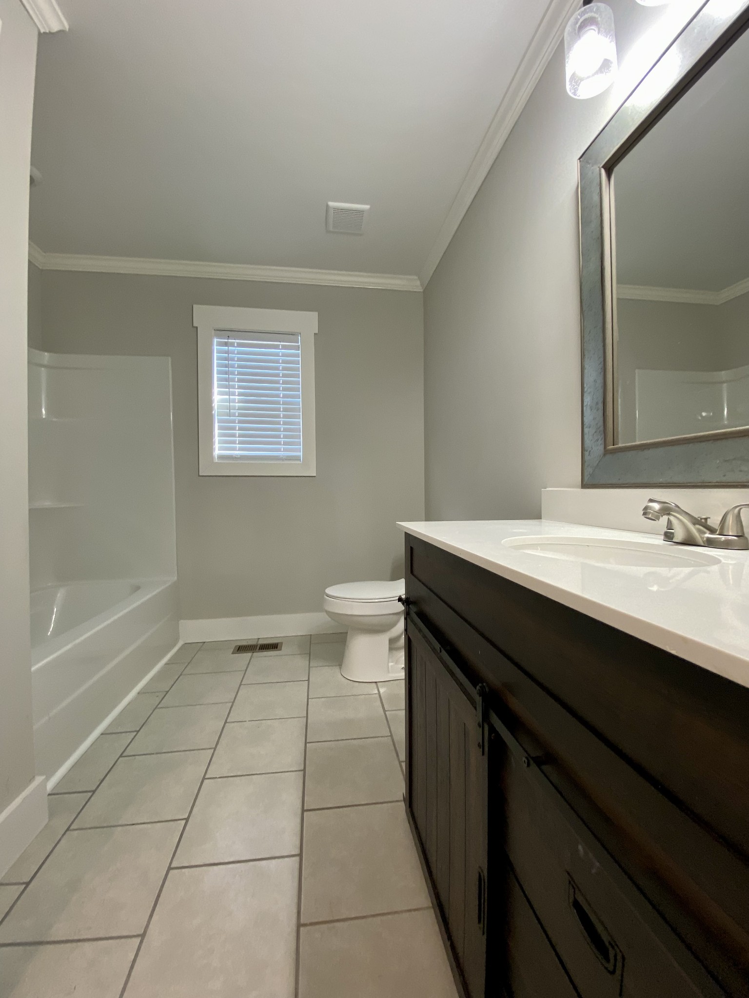 90 Allred Road Decherd, TN 37324 - Photo 12 of 22 a bathroom with a sink a toilet and shower