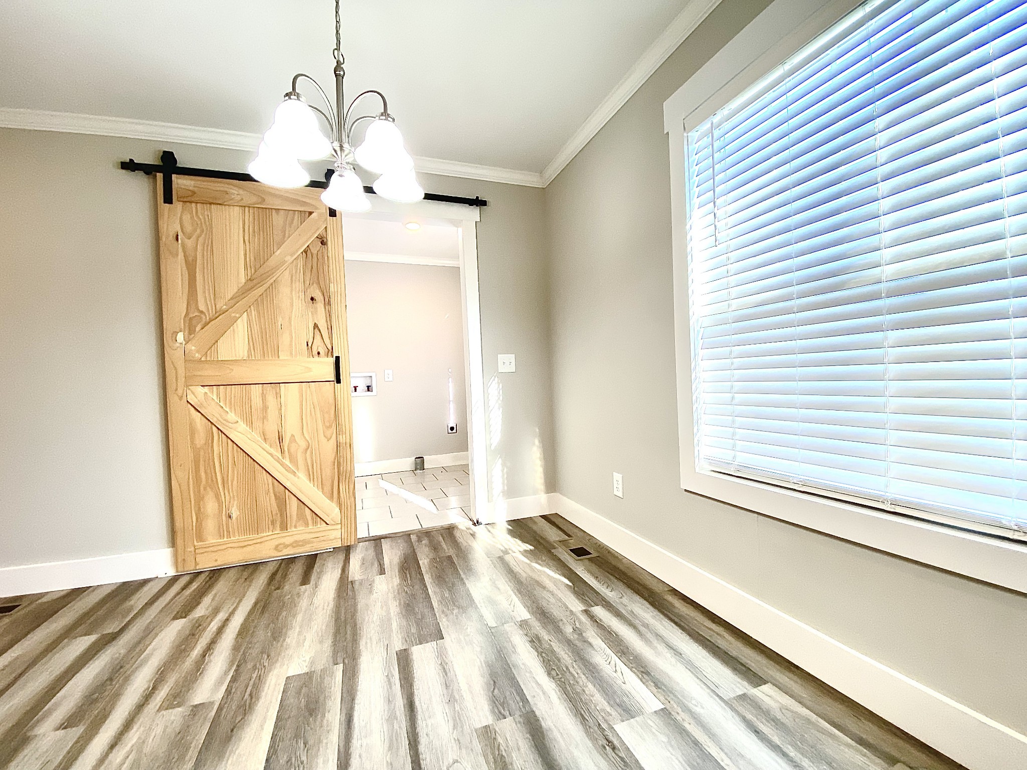 90 Allred Road Decherd, TN 37324 - Photo 5 of 22 a view of a room with wooden floor and windows