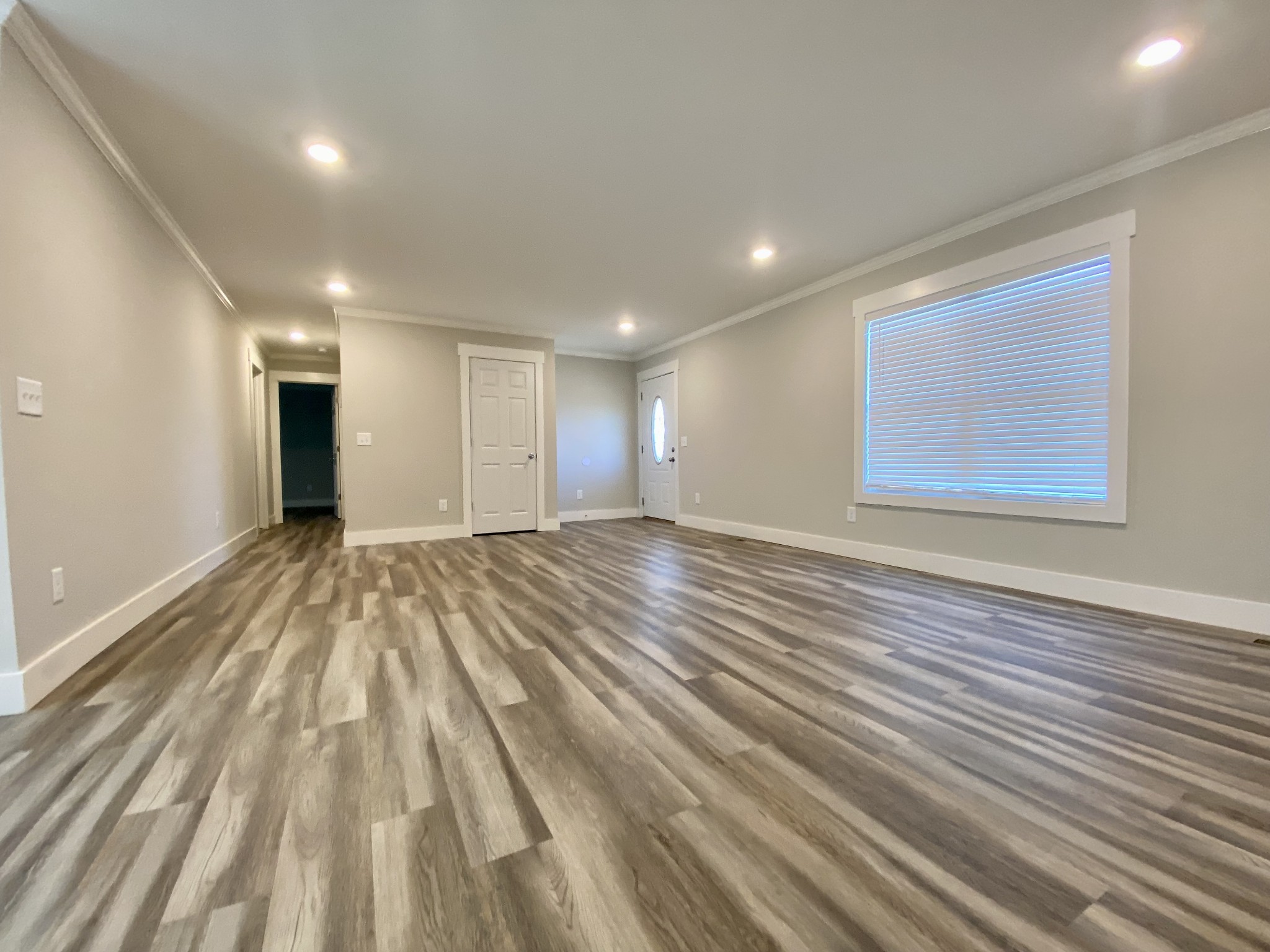 90 Allred Road Decherd, TN 37324 - Photo 9 of 22 a view of an empty room with wooden floor and a window