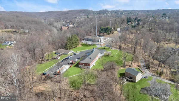 an aerial view of a house with outdoor space