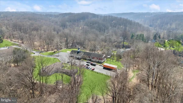 an aerial view of a house with a garden