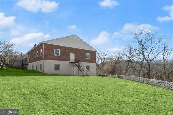 a view of a couches in backyard of house