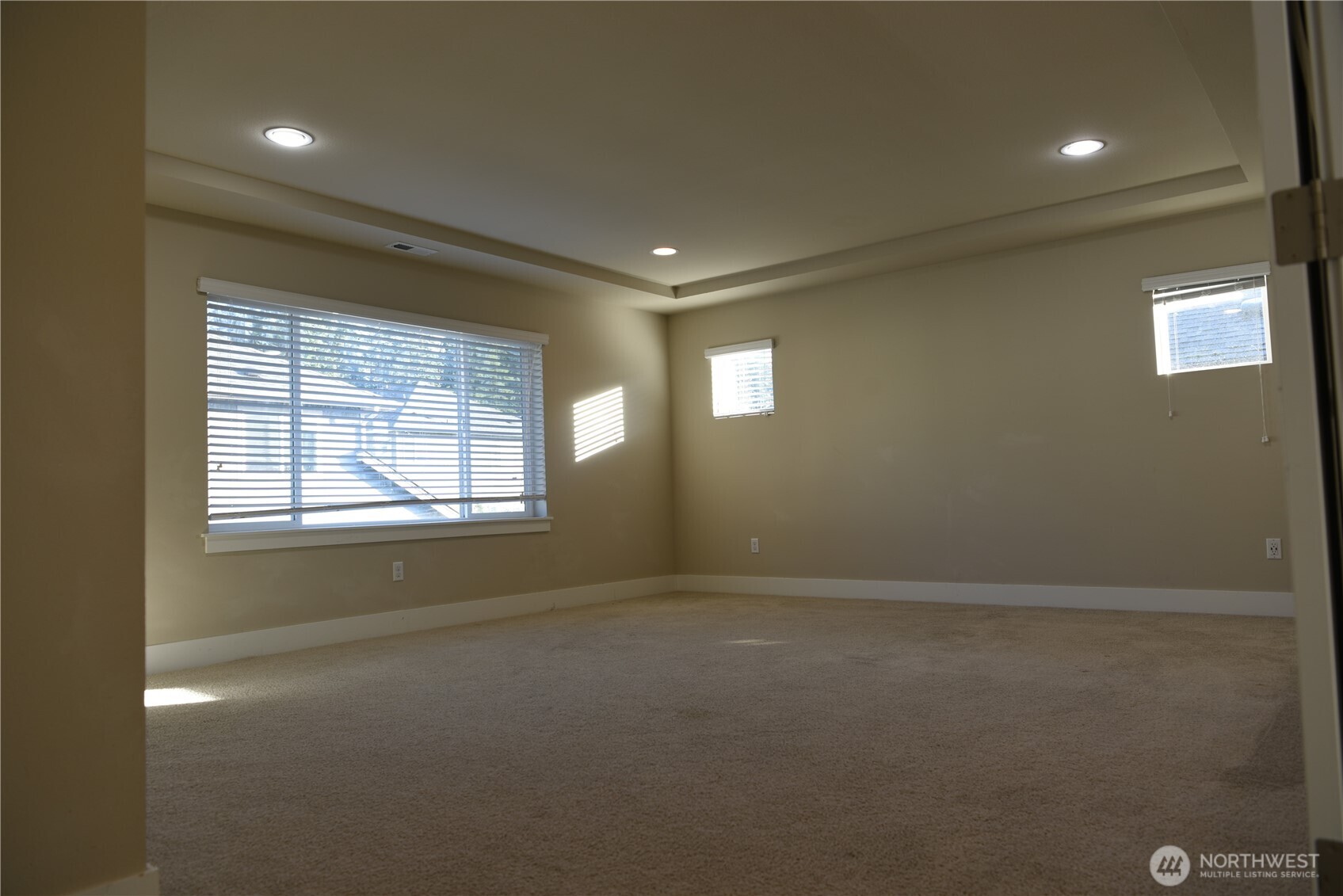 21417 43rd Drive Southeast, Unit 19 Bothell, WA 98021 - Photo 16 of 30 en empty room with windows and yard