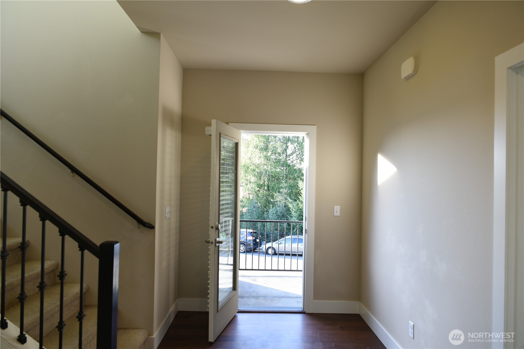 21417 43rd Drive Southeast, Unit 19 Bothell, WA 98021 - Photo 8 of 30 a view of a hallway with wooden floor and stairs
