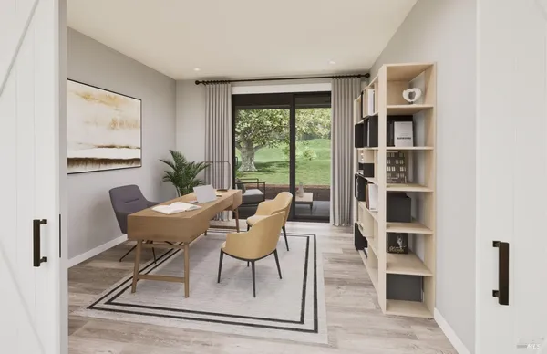 a view of a dining room with furniture and wooden floor