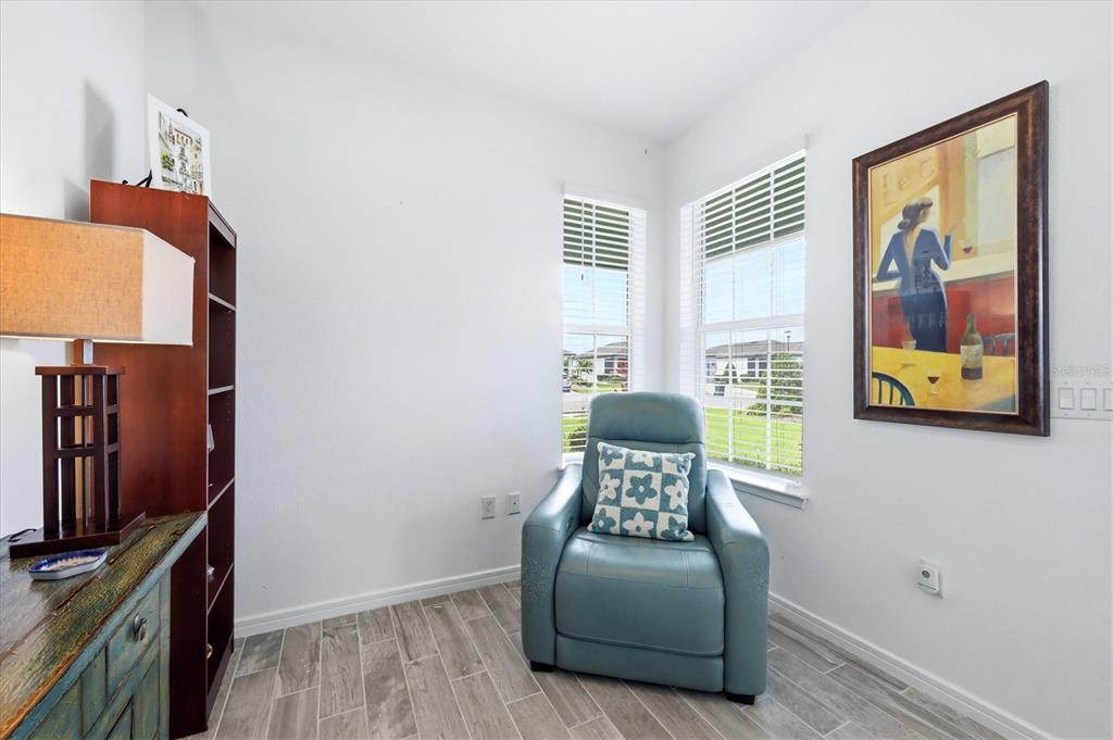 8706 Ocean Tides Cove Parrish, FL 34221 - Photo 16 of 63 a living room with furniture and a flat screen tv