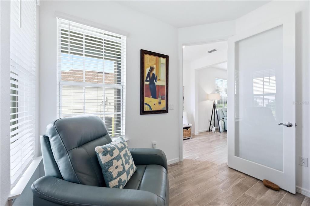 8706 Ocean Tides Cove Parrish, FL 34221 - Photo 17 of 63 a living room with furniture and a large window
