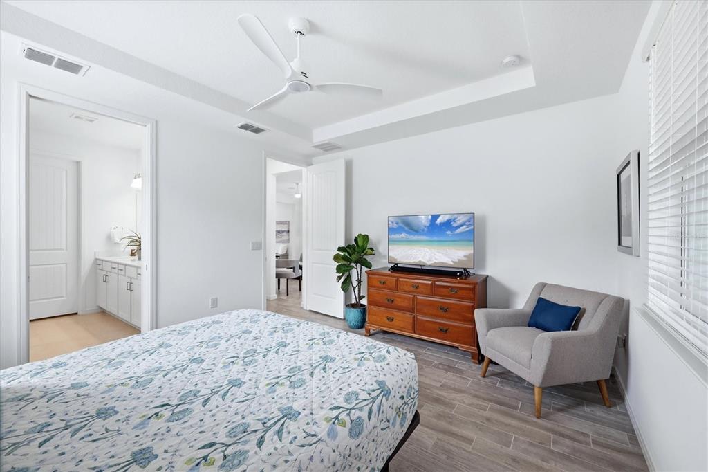 8706 Ocean Tides Cove Parrish, FL 34221 - Photo 20 of 63 a bedroom with a bed and a couch