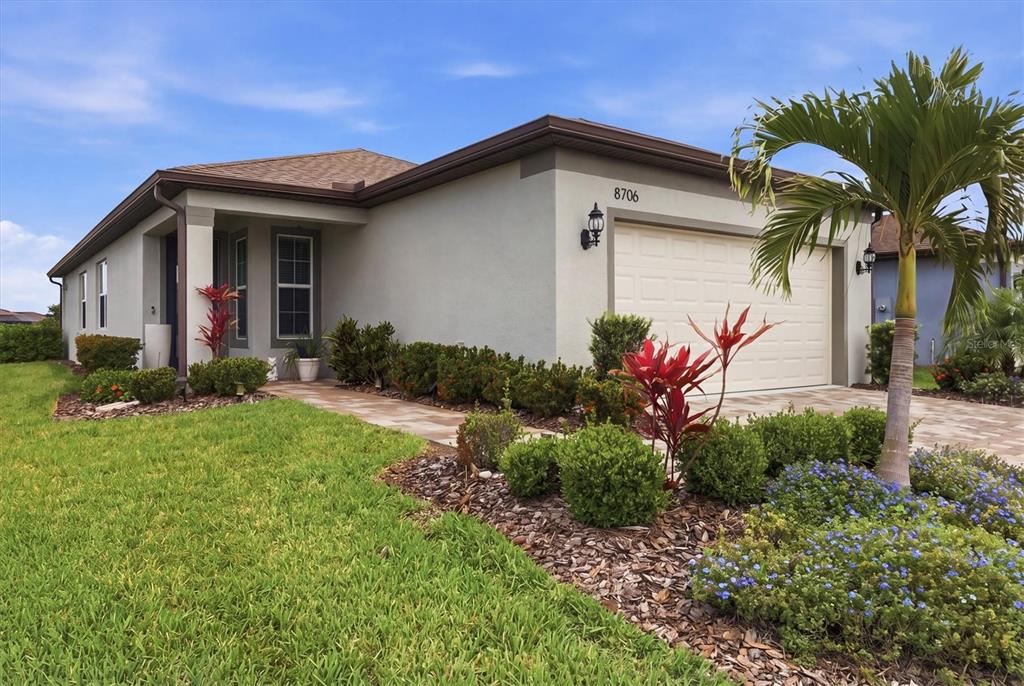 8706 Ocean Tides Cove Parrish, FL 34221 - Photo 2 of 63 a front view of a house with a yard