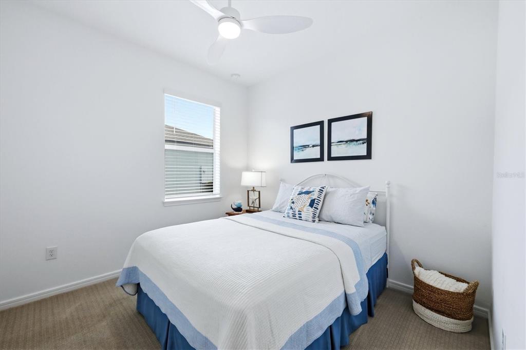 8706 Ocean Tides Cove Parrish, FL 34221 - Photo 25 of 63 a bedroom with a bed and a window