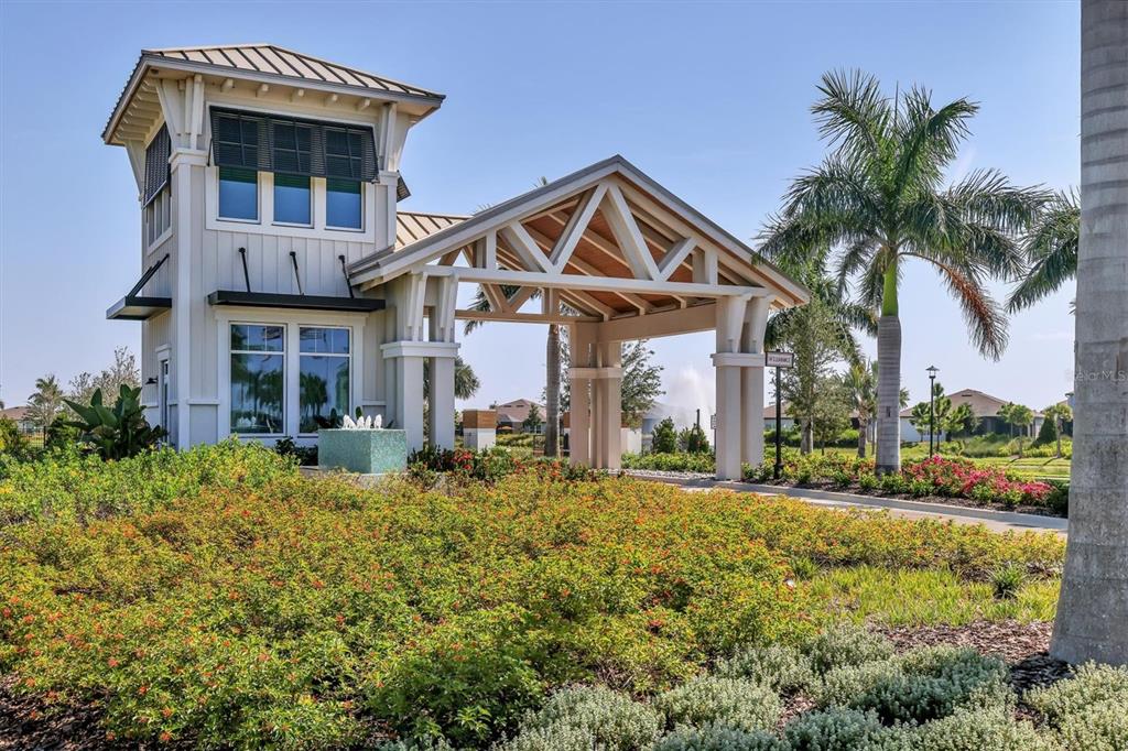 8706 Ocean Tides Cove Parrish, FL 34221 - Photo 36 of 63 a front view of a house with garden