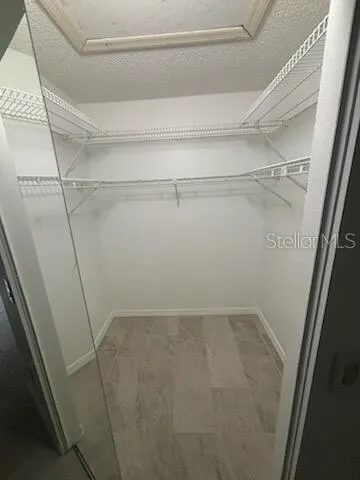 a view of a room with racks on the wall