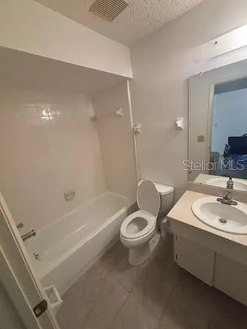 a bathroom with a sink a toilet and bathtub