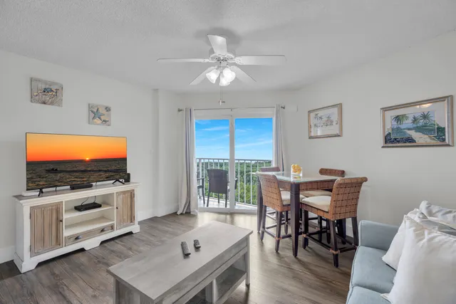 a view of a livingroom with furniture and a flat screen tv
